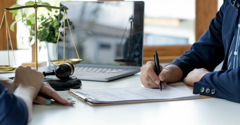 Businessman signing a document